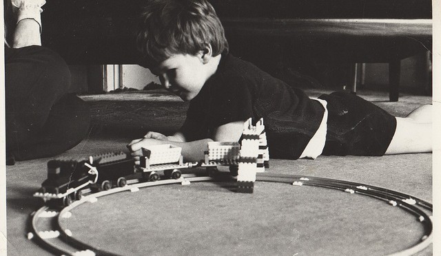 child playing with his lego train