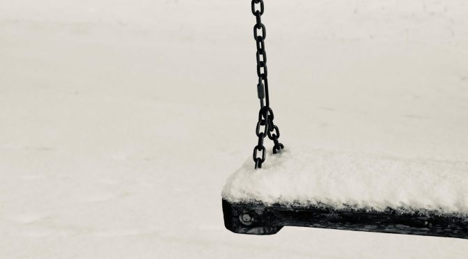 a swing covered with snow