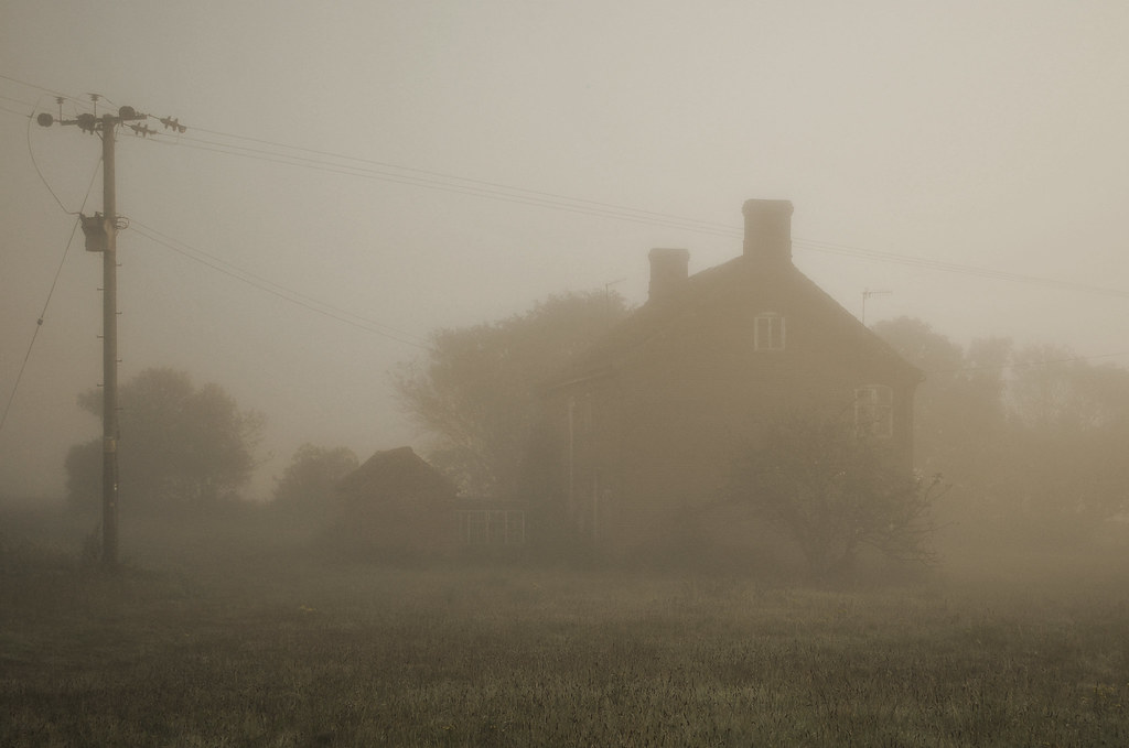 An image of a house, shrouded in mist