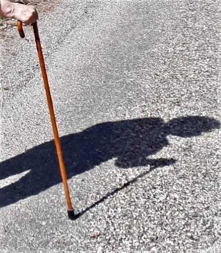 The shadow of grandma with her cane